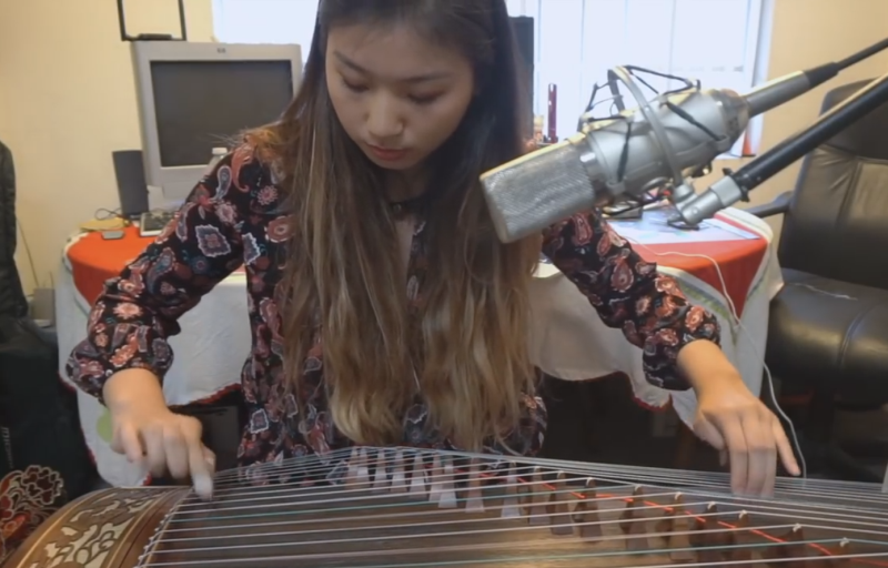 Kuan works her magic on the zither.
