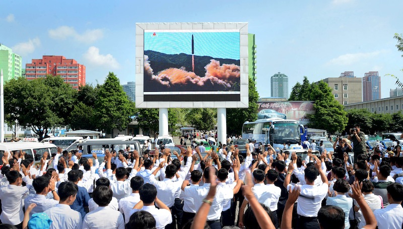 People watch a huge screen showing the test launch of intercontinental ballistic missile Hwasong-14 in this undated photo released by North Korea's Korean Central News Agency, July 5, 2017. u00e2u20acu201d Reuters pic