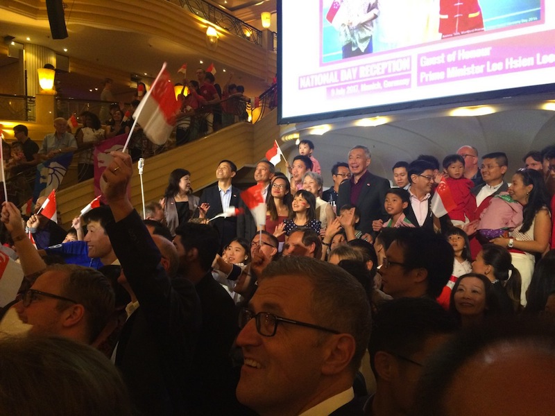 Lee Hsien Loong taking a group photo with Singaporeans at Munich's Bayerischer Hof hotel in an early celebration of National Day.u00c2u00a0u00e2u20acu201d Picture by Neo Chai Chin