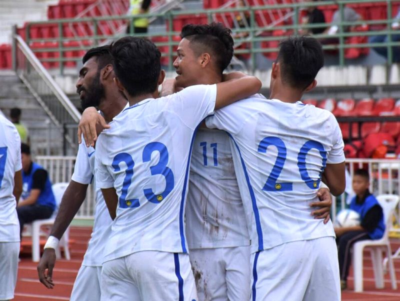 Malaysian players celebrate after crippling Indonesia 3-0 during the Under-23 Group AFC qualification match. u00e2u20acu2022 Bernama pic