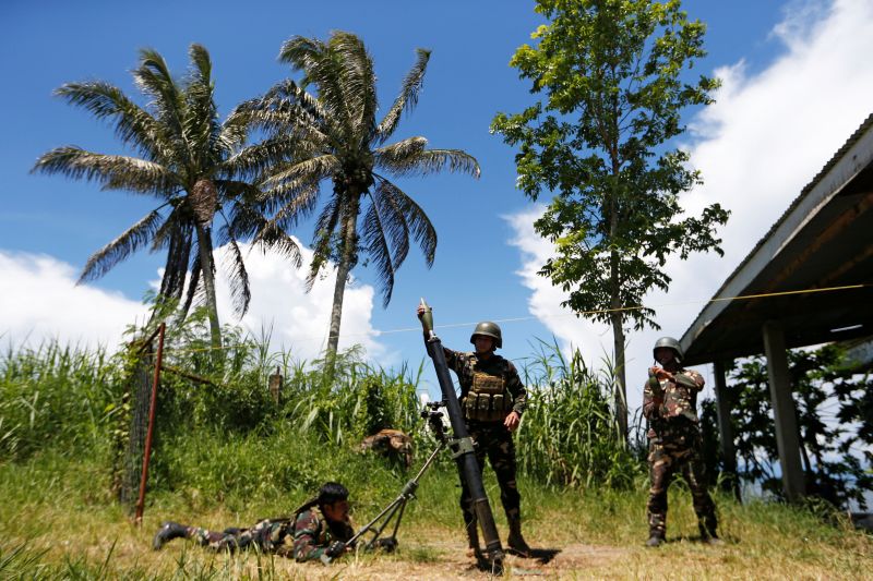 Filipino soldiers launch a mortar from their combat position as government troops continue their assault against insurgents from the Maute group in Marawi city, Philippines July 1, 2017. u00e2u20acu201d Reuters pic