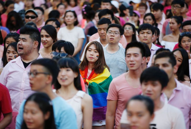 A woman wrapped in the rainbow flag is seen at the Pink Dot rally, Singapore's annual gay pride rally, at a park in Singapore July 1, 2017. u00e2u20acu201d Reuters pic