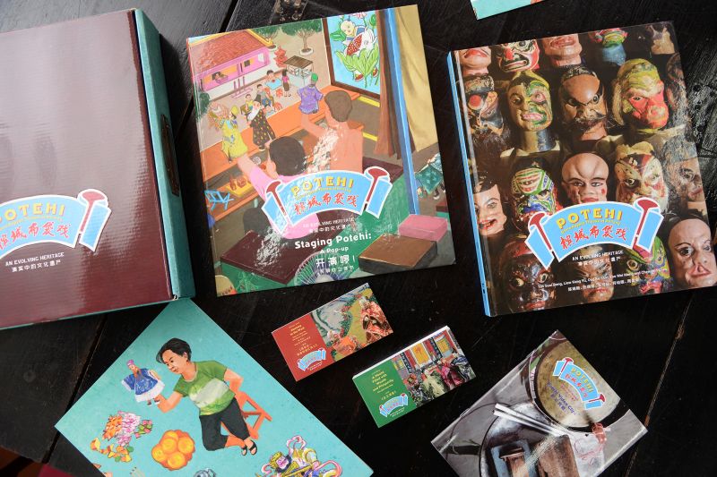 The boxset consists of one hardcover bilingual book filled with information, pictures and illustrations on the history of u00e2u20acu02dcpotehiu00e2u20acu2122, the present-day u00e2u20acu02dcpotehiu00e2u20acu2122 troupes and the rituals involved in the performances. u00e2u20acu201d Picture by KE Ooi