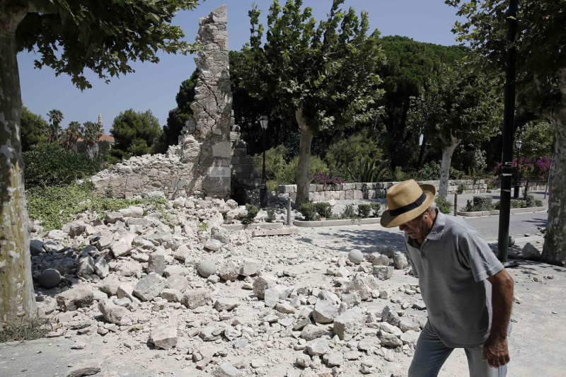 A man walks past debris following an earthquake on the island of Kos July 21, 2017. u00e2u20acu201d Reuters pic