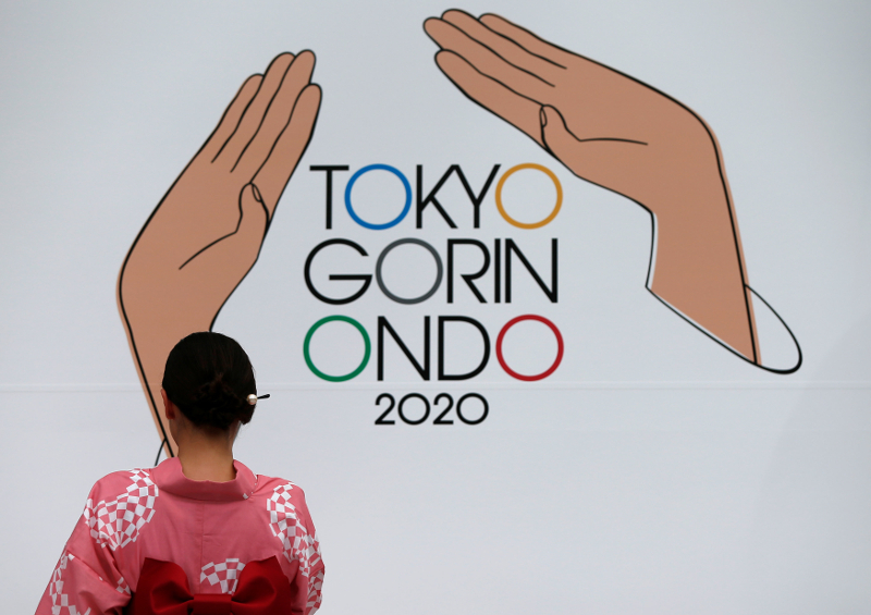 A woman dressed in yukata participates in unveiling a new version of the Tokyo 1964 Olympic Games u00e2u20acu02dcTokyo Gorin Ondou00e2u20acu2122, during a ceremony counting down three years to the Tokyo 2020 Summer Olympics, in Tokyo July 24, 2017. u00e2u20acu201d Reuters pic