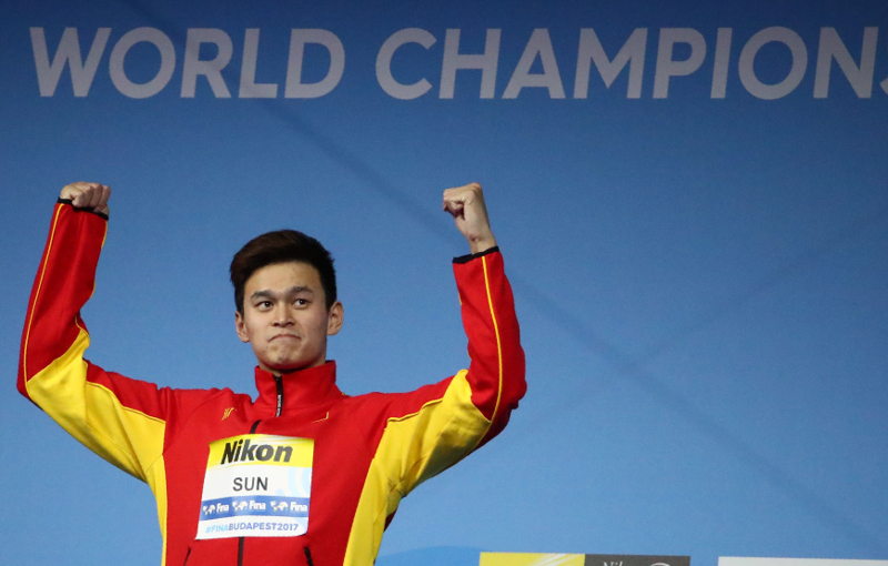 Sun Yang of China (gold) celebrates at the podium after winning the Menu00e2u20acu2122s Freestyle 200m at the 17th Fina World Aquatics Championships in Budapest July 25, 2017. u00e2u20acu201d Reuters pic