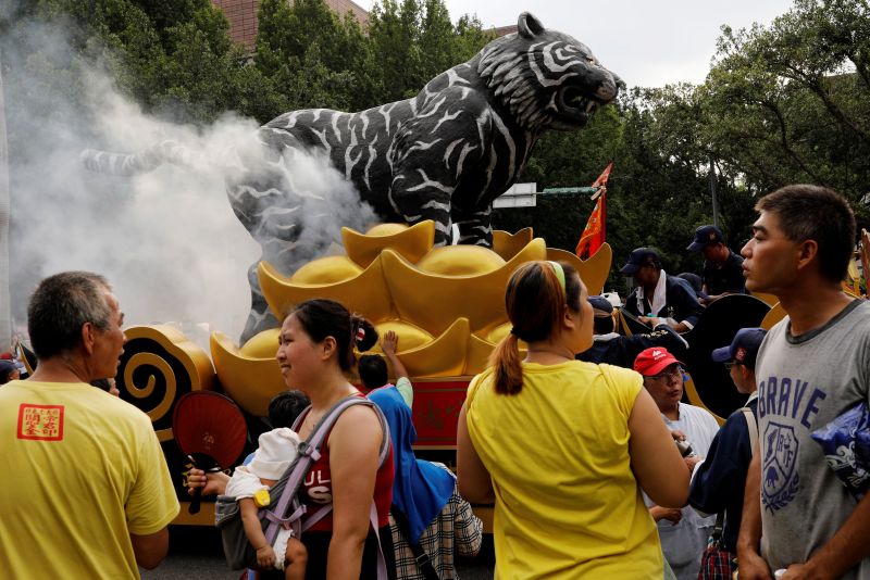 A vehicle with a statue of tiger is seen during a religion parade against the government's policy to cut down paper burnings in an attempt to improve air quality, in Taipei July 23, 2017. u00e2u20acu201d Reuters pic