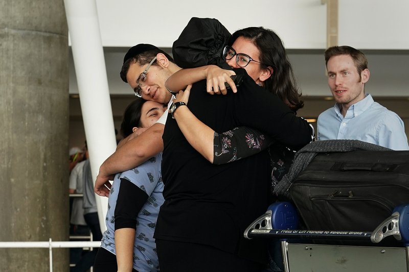 People hug after arriving in advance of the incoming travel ban to the US at John F Kennedy airport in New York June 29, 2017. u00e2u20acu201d Reuters pic