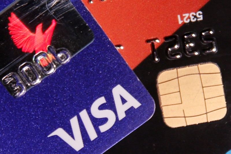 A Visa credit card is pictured next to a computer chip on a bank card in this photo illustration taken June 9, 2016. u00e2u20acu201d Reuters pic