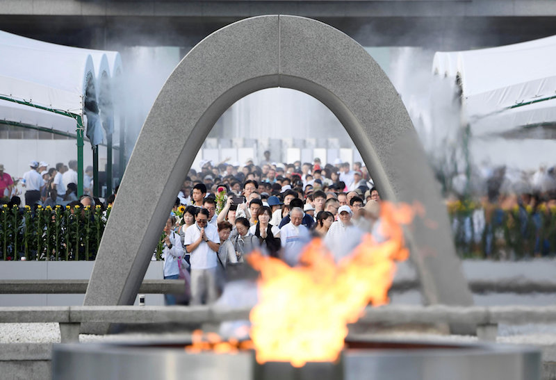 People pray for atomic bomb victims in front of the cenotaph for the victims of the 1945 atomic bombing, at Peace Memorial Park inu00c2u00a0Hiroshima August 6, 2017, on the 72nd anniversary of the atomic bombing of the city. u00e2u20acu201d Handout by Kyodo via Reuters