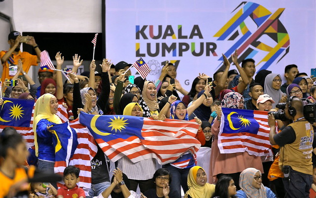 Malaysian supporters in happy mood after their national netball team beat Singapore 50-37 in KL2017 SEA Games preliminary match at Stadium Juara Bukit Kiara today. u00e2u20acu201d Bernama pic