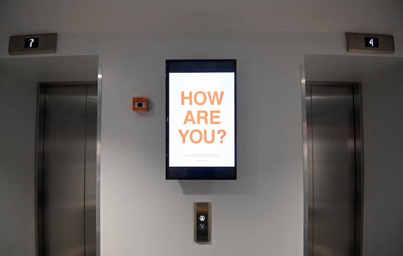 A digital display reminding residents or ‘members’ to give feedback on their co-living experience is seen in a lift foyer at The Collective co-living building in London August 14, 2017. — Reuters pic