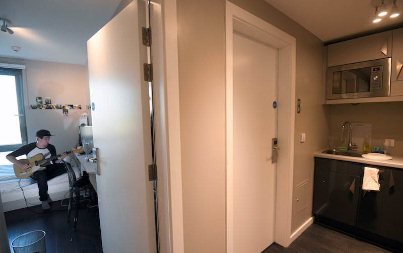 Jonny Cass, a 22-year-old cinematographer practices playing guitar in his room in a shared apartment at The Collective co-living building in London August 15, 2017. u00e2u20acu201d Reuters pic