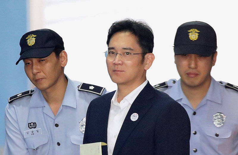 Lee Jae-yong, Samsung Group heir arrives at Seoul Central District Court to hear the bribery scandal verdict in Seoul August 25, 2017. — Reuters pic