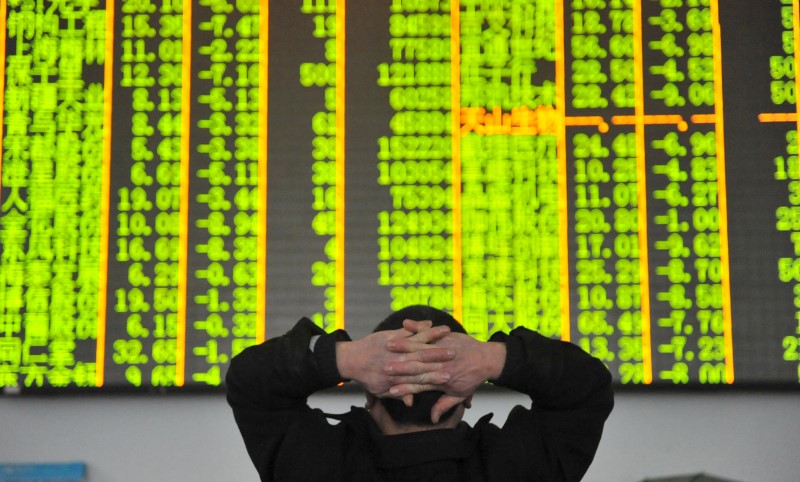 An investor looks at an electronic screen at a brokerage house in Hangzhou, Zhejiang province, January 26, 2016. u00e2u20acu201d Reuters pic