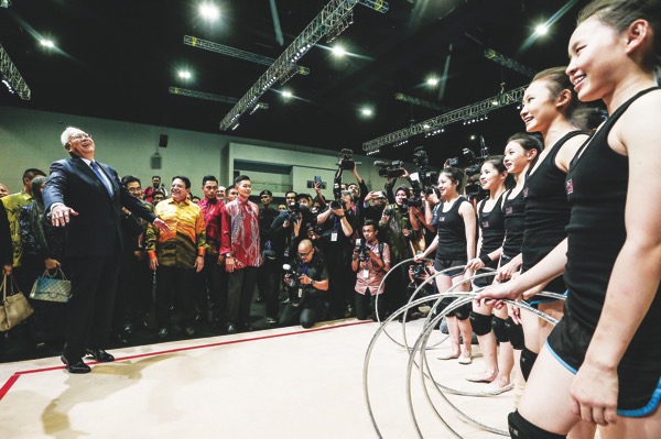 Prime Minister Datuk Seri Najib Razak has words of encouragement for members of the rhythmic gymnastics team at the handing over of Mitec yesterday. u00e2u20acu201d Picture by Hari Anggara
