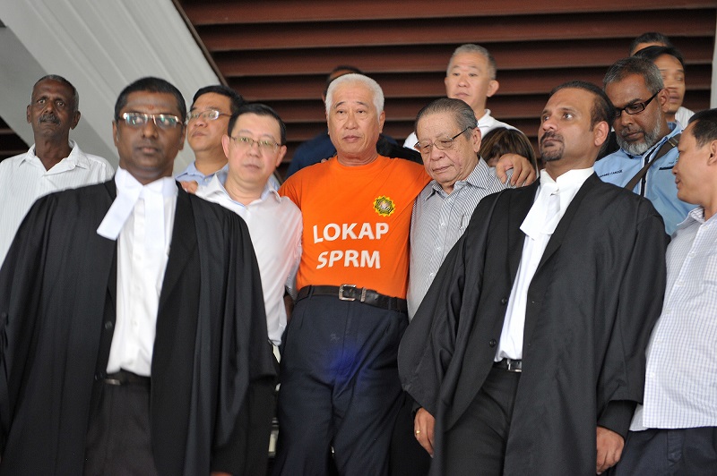 Penang state executive councillor Phee Boon Poh leaving the court in George Town August 14, 2016. u00e2u20acu201d Picture by KE Ooi
