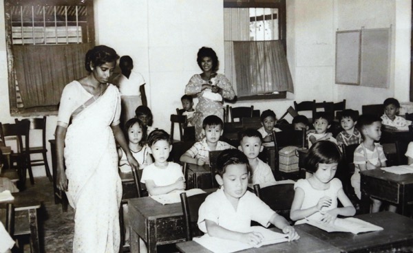 Parameswary in a class with underpriviledged students in 1957. 