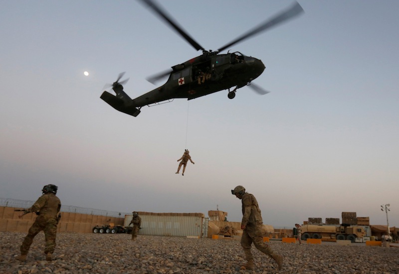 A US Navy Corpsman and US soldier take part in a helicopter Medevac exercise in Helmand province, Afghanistan, July 6, 2017. u00e2u20acu201d Reuters pic