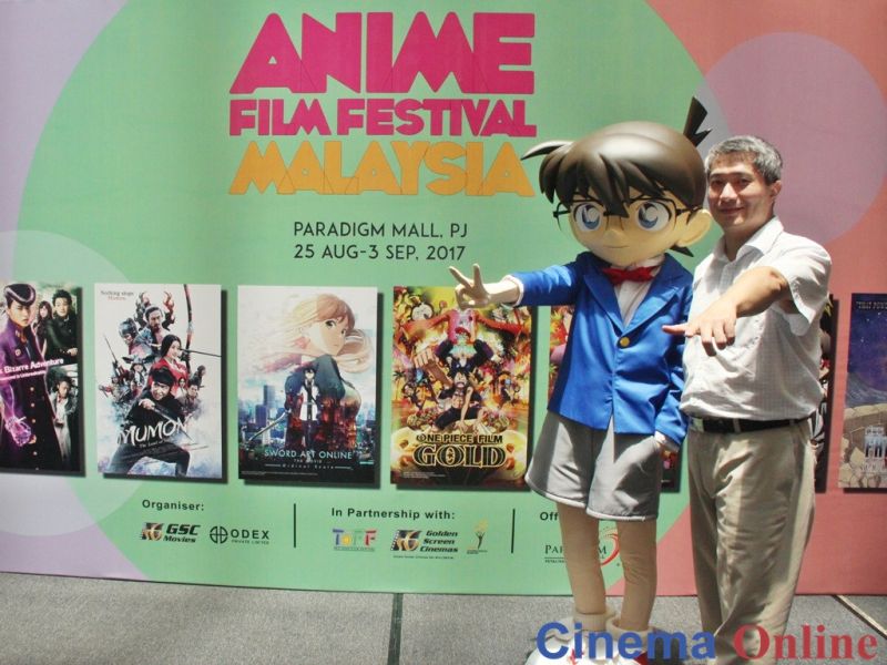 Popular anime character Detective Conan poses with Odex Private Limited Managing Director Peter Go at Anime Film Festival Malaysia 2017. u00e2u20acu201d CinemaOnline pic 