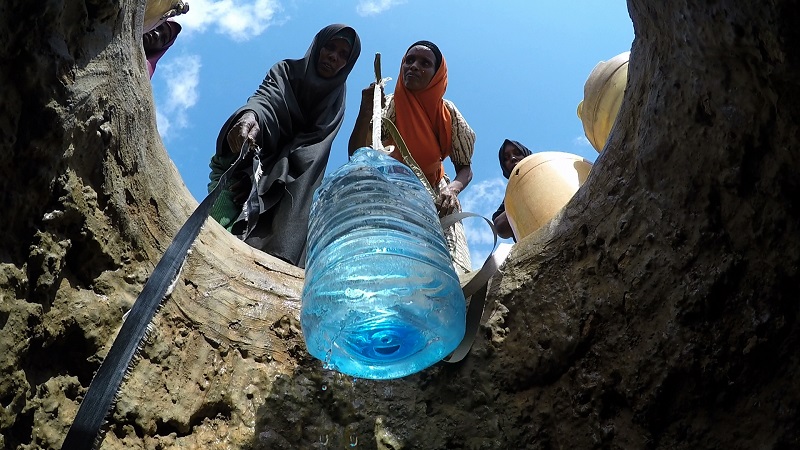 Women drawing water from a hand-dug well in Alimao, Kenya, February 2017, in this picture by Charles Kariuki, World Vision. — Thomson Reuters Foundation