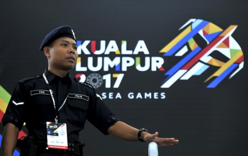 A policeman stands guard in front of KL2017 logo to maintain public order and safety during the Kuala Lumpur SEA Games 2017 at the National Aquatic Centre in Bukit Jalil today. u00e2u20acu201d Bernama pic