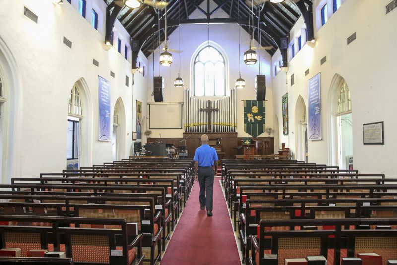 Inside St Andrew's 100-year-old sanctuary, where the original wooden rafters and the upgraded pipe organ can be seen. ― Picture by Choo Choy May