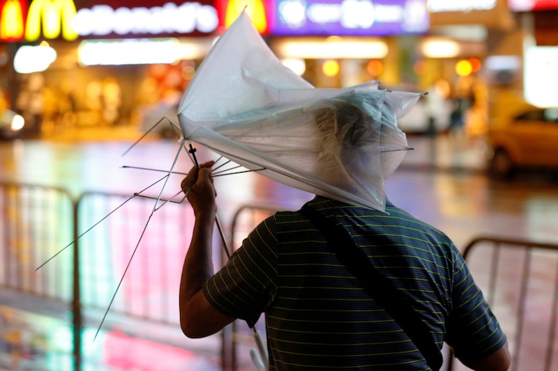 A man carrying a broken umbrella braves strong wind and rains as Typhoon Nesat hits Taipei, Taiwan July 29, 2017. u00e2u20acu201du00c2u00a0Reuters pic 