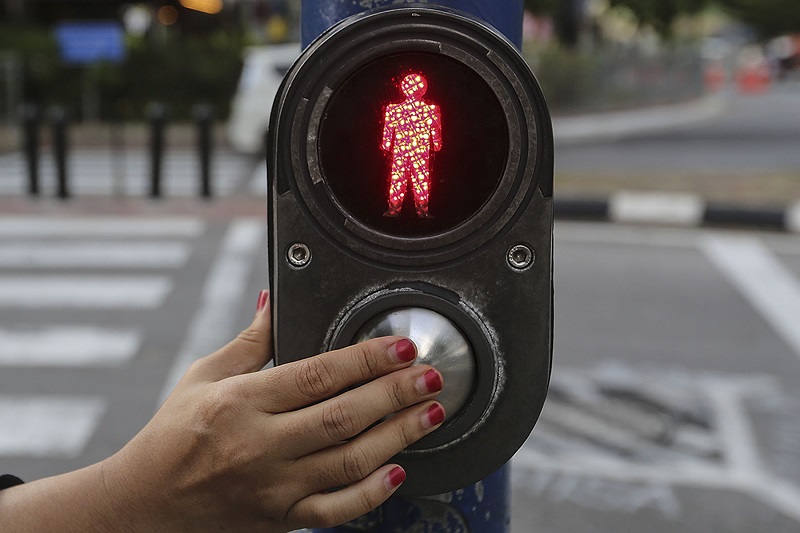 The u00e2u20acu02dcwalku00e2u20acu2122 buttons pedestrians press to speed up the green light. Chances are it makes no difference at all, yet it caters to our need to u00e2u20acu02dcdo somethingu00e2u20acu2122 while waiting (i.e. our action bias). u00e2u20acu201d Picture by Yusof Mat Isa
