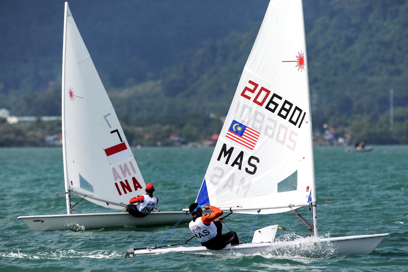 National sailor Ahmad Latif Khan is seen competing with Indonesia's Ahmad Zainuddin in the Men's Laser Radial category in the waters of Kuah near the National Sailing Centre in Langkawi August 25, 2017. u00e2u20acu201d Bernama pic