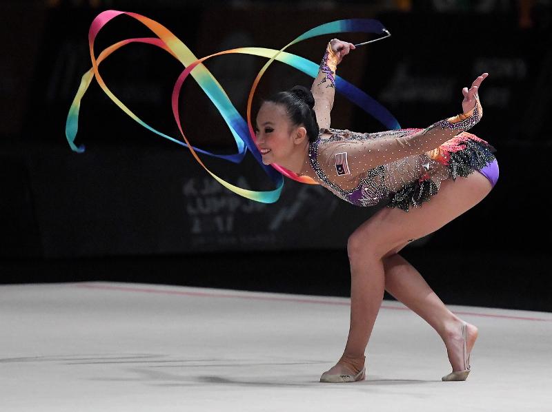 Gymnast Amy Kwan Dict Weng presents a colourful display in the ribbon discipline of the Individual Rhythmic Gymnastic event at Mitec, Kuala Lumpur August 28, 2017. u00e2u20acu201d Bernama pic