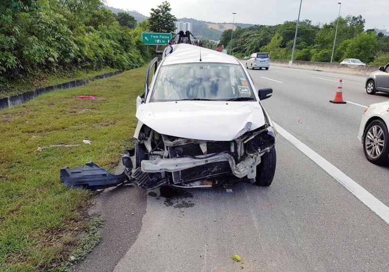 The stolen car after it collided with another vehicle, killing its driver, on the SILK Highway yesterday. u00e2u20acu2022 Malay Mail pic