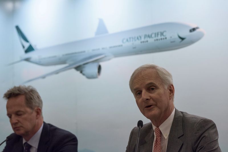 Cathay Pacificu00e2u20acu2122s Chairman John Slosar (right) speaks next to chief executive officer Rupert Hogg during a press conference on the company's half-year results in Hong Kong on August 16, 2017. u00e2u20acu201d AFP pic
