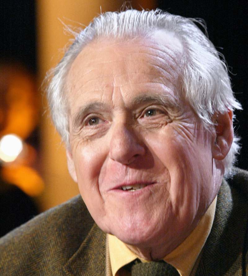 Food critic Christian Millau poses on March 30, 2004 in Paris on the set of the TV programme 'Flight of Night' on TF1, where he presented his book 'Bons baisers du goulag' or 'Good kisses From the Gulag.' u00e2u20acu201d AFP pic