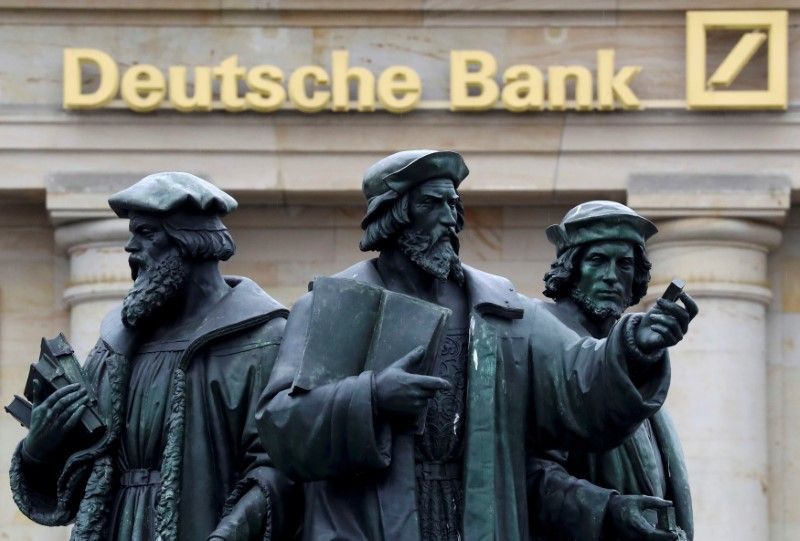 A statue is pictured next to the logo of Germany's Deutsche Bank in Frankfurt September 30, 2016. u00e2u20acu201d Reuters picn