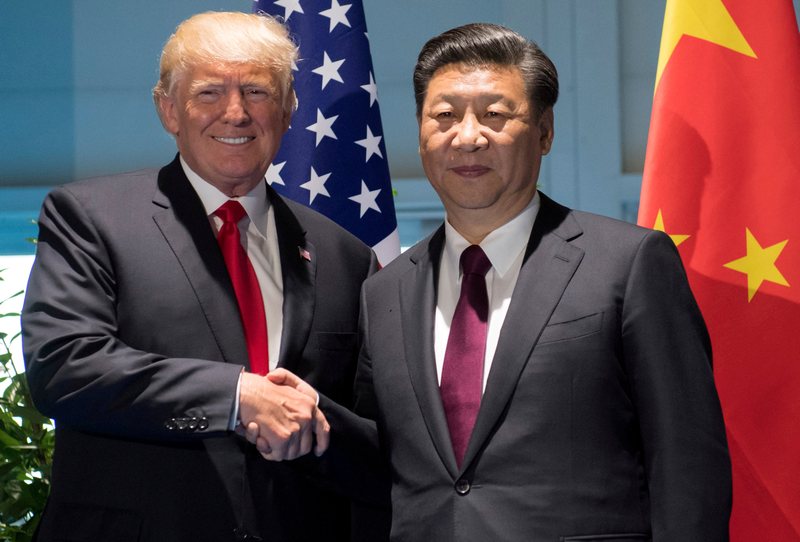 US President Donald Trump (left) and Chinese President Xi Jinping shake hands prior to a meeting on the sidelines of the G20 Summit in Hamburg July 8, 2017. u00e2u20acu201d Reuters pic 