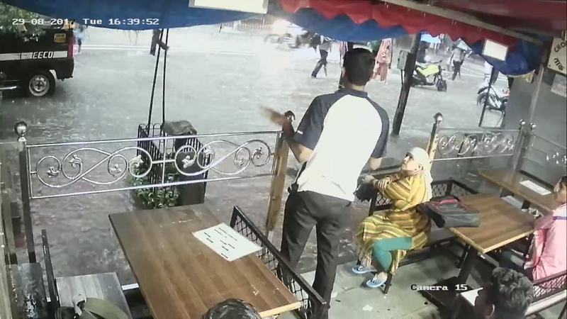 People look at a flooded street during heavy rains in Parel neighbourhood of Mumbai August 29, 2017 in this still image obtained from a CCTV camera. u00e2u20acu201d Reuters pic 