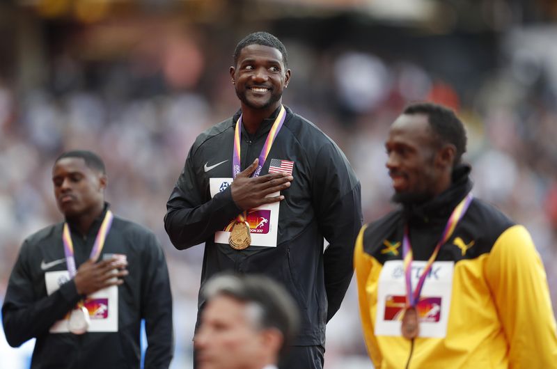 Justin Gatlin of the US celebrates his gold with silver medallist Christian Coleman of the US (left) and bronze medallist Usain Bolt of Jamaica (right) during the 100m victory ceremony in London Stadium, August 6, 2017. u00e2u20acu201d Reuters pic