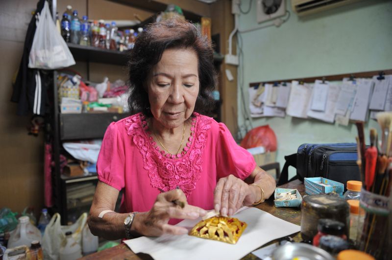 Yuen Siew Lan has been restoring antique furniture and layering gold leaf on antique furniture for almost 40 years. u00e2u20acu2022 Picture by KE Ooi
