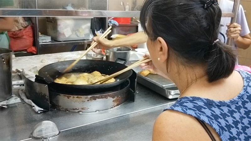 Customers at this hum chim peng stall have been frying up their own dough fritters for over 30 years. u00e2u20acu201d TODAY pic