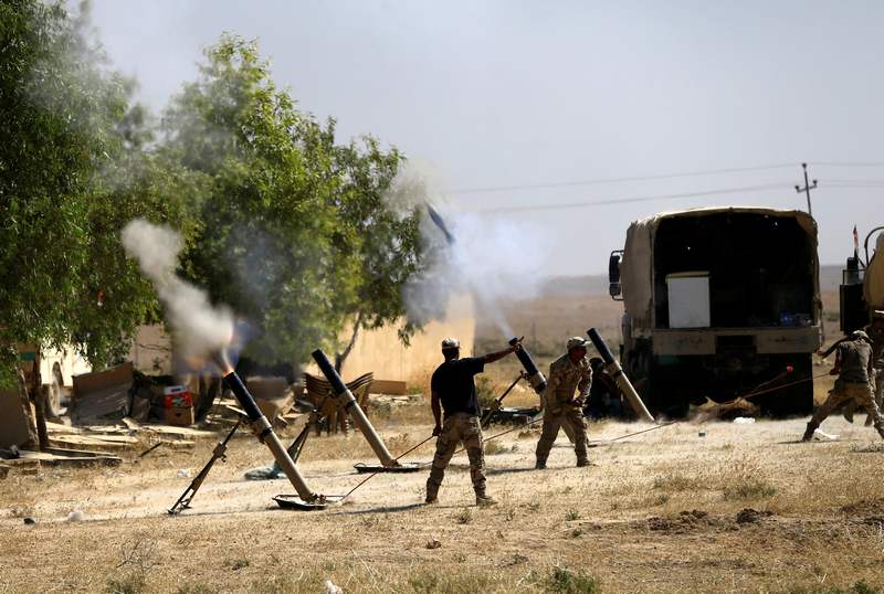 Members of Iraqi Army fire mortar shells during the war between Iraqi army and Shi'ite Popular Mobilisation Forces (PMF) against the Islamic State militants in Tal Afar August 28, 2017. u00e2u20acu201d Reuters pic