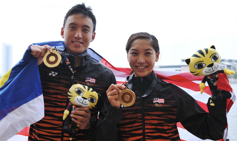 Gold for Kevin Yeap Soon Choy and Heidi Gan in the SEA Games 10K Open swimming men's and women's category at the Putrajaya Water Sports Complex August 18, 2017. u00e2u20acu201d Bernama pic