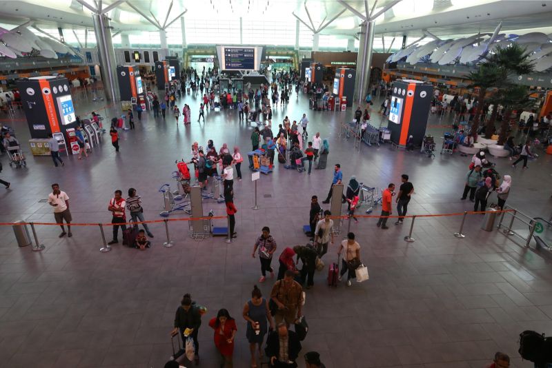 Travellers at KL International Airport. It is estimated over 800,000 people are trafficked internationally each year. u00e2u20acu201d Picture by Zuraneeza Zulkifli