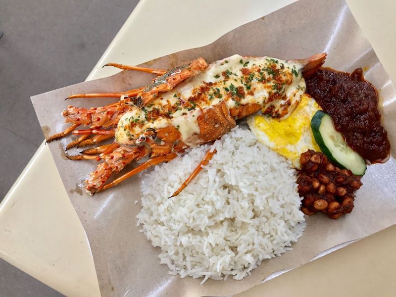 Lawa Bintangu00e2u20acu2122s lobster nasi lemak consists of a whole lobster with cheese and seasoned with herbs, and served with sambal chilli, fried egg and anchovies. u00e2u20acu201d TODAY pic