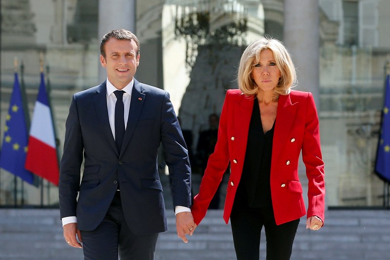 French President Emmanuel Macron and his wife Brigitte Macron walk in the Elysee Palace courtyard July 6, 2017 prior to the launching of a programme for autism, in Paris. u00e2u20acu201d Reuters pic