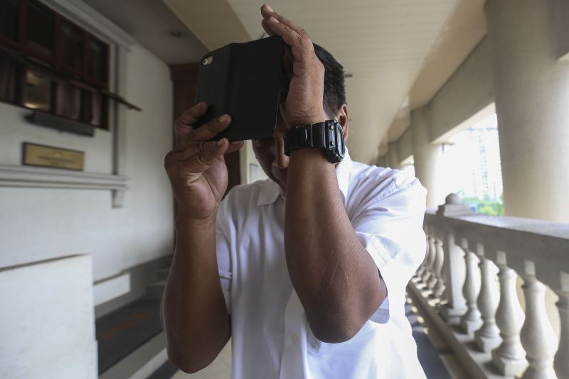 Mazlan Yusof, 47, is pictured outside the Cyber Court at Duta Court Complex in Kuala Lumpur, August 18, 2017.
