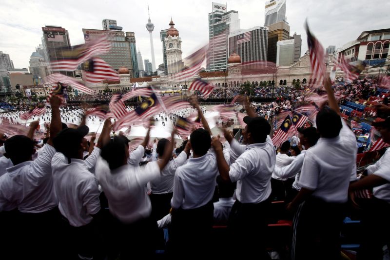 Students wave the Jalur Gemilang during the full rehearsal for National Day 2017 at Dataran Merdeka in Kuala Lumpur August 29, 2017. u00e2u20acu2022 Bernama pic