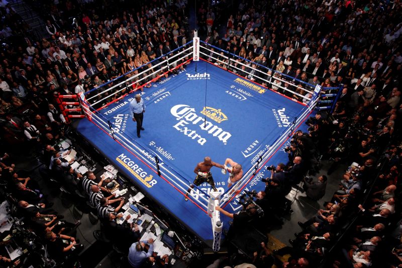 Undefeated boxer Floyd Mayweather Jr. (left) of the U.S. punches UFC lightweight champion Conor McGregor of Ireland during their super welterweight boxing match at T-Mobile Arena in Las Vegas August 27, 2017. u00e2u20acu201d Reuters pic