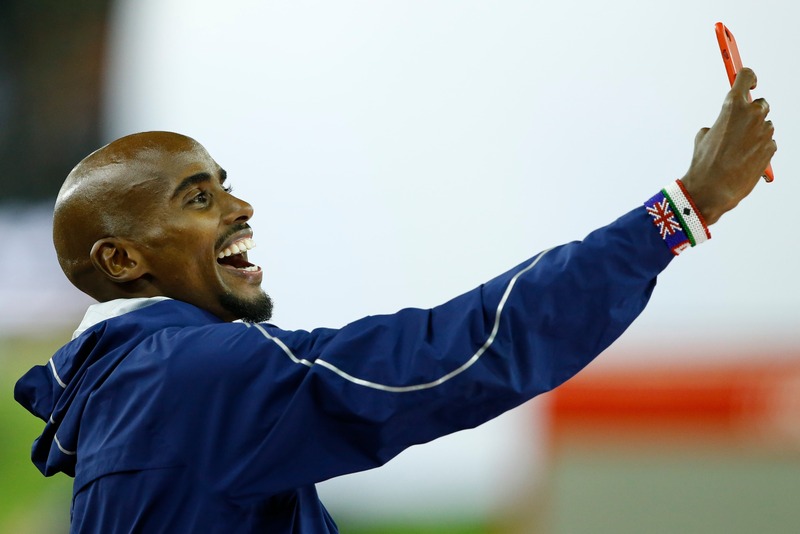Mo Farah takes a selfie during a victory ceremony of the Diamond League athletics meet in Zurich August 24, 2017. u00e2u20acu201d Reuters pic