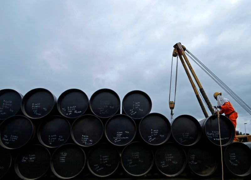 A worker prepares to transport oil pipelines to be laid for the Pengerang Gas Pipeline Project at an area 40km away from the Pengerang Integrated Petroleum Complex in Pengerang, Johor February 4, 2015. u00e2u20acu201d Reuters pic